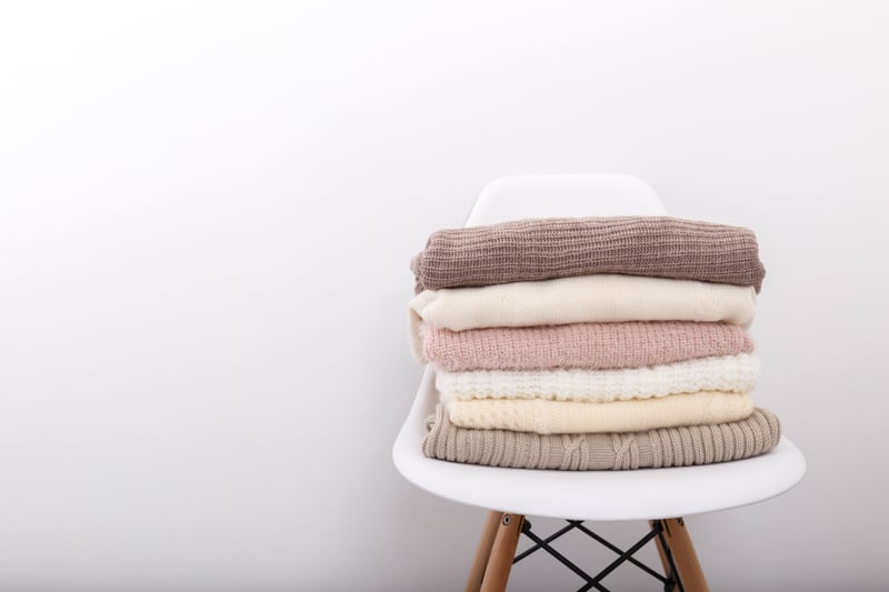 Stack Of Cozy Knitted Sweaters